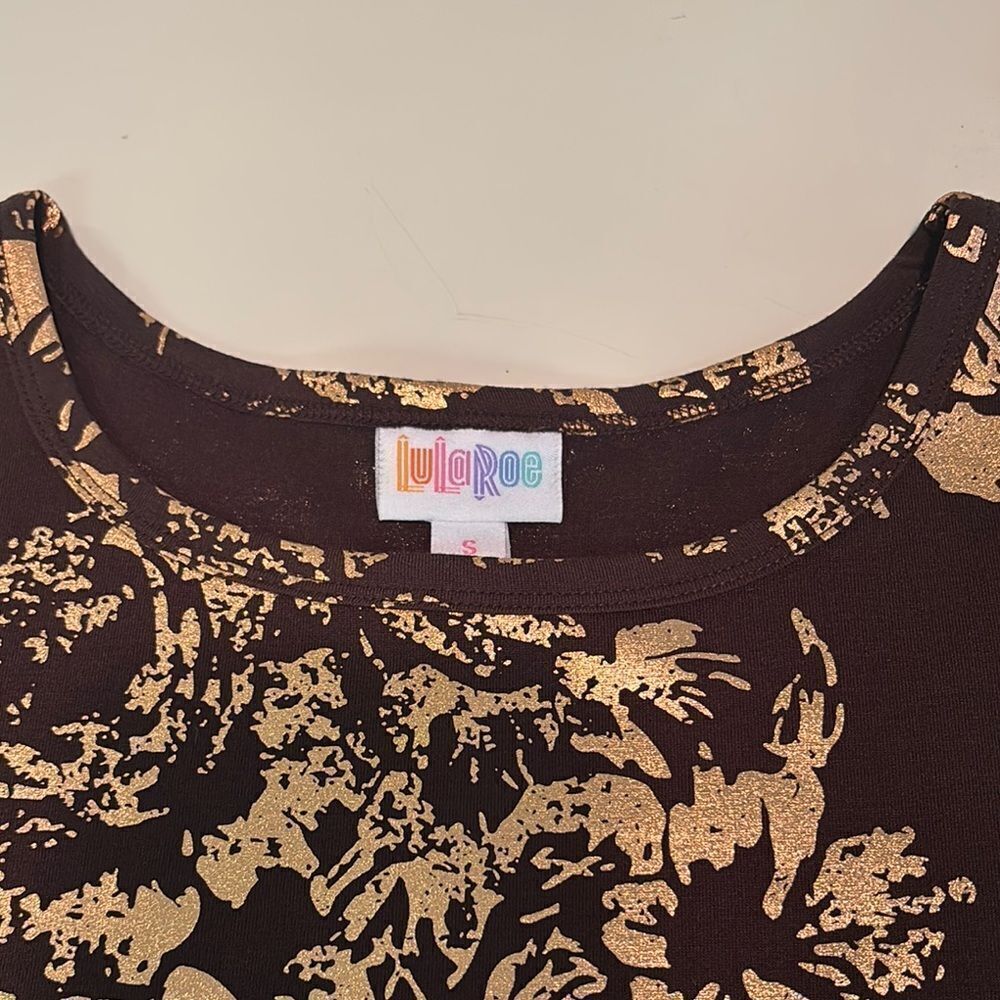 LuLaRoe Top with Gold Accents on Dark Brown